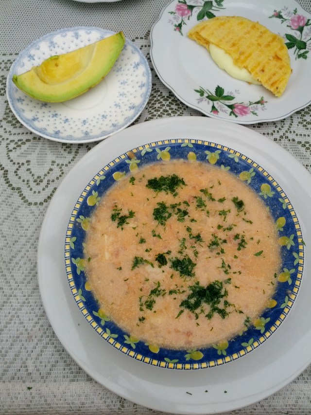 Pale salmon colour lumpy liquid..